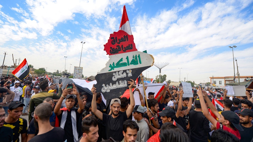 Iraqi protesters mark the first anniversary of the mass protest movement which saw demonstrators demand better public services, reform and an end to rampant corruption. Najaf, Iraq. Oct. 25, 2020(Photo via Getty Images)
