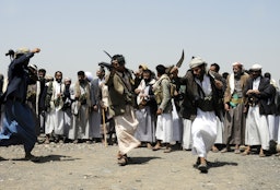 Fighters dance during a protest held to support unities of Houthi Ansarullah Movement in Sanaa, Yemen on Aug. 11, 2016. (Photo by Mohammed Hamoud/Anadolu Agency/Getty Images)