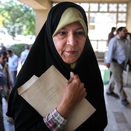 Faezeh Hashemi, daughter of two-time president Akbar Hashemi Rafsanjani, before her trial. Tehran, Iran,  Aug. 7, 2013. (Photo by Sina Shiri via Fars News Agency)