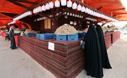 Women buy desert truffles in Kuwait City, Feb. 3, 2021. (Photo via Getty Images)