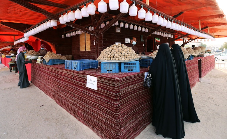 Women buy desert truffles in Kuwait City, Feb. 3, 2021. (Photo via Getty Images)