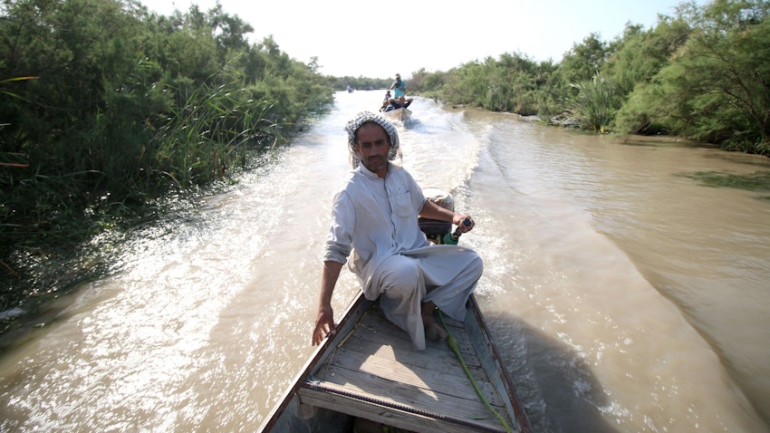 A man on a boat ride in the Iraqi Marshlands. July 14, 2016 Maysan governorate, Southern Iraq (Photo via Getty Images)