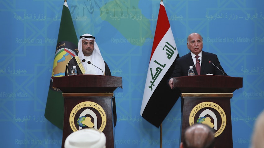 GCC Secretary Nayef Al-Hajraf (left) and Iraqi Foreign Minister Fuad Hussein (right) hold a joint press conference in Baghdad, Iraq on Feb. 1, 2021.  (Photo via Getty Images)