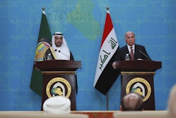 GCC Secretary Nayef Al-Hajraf (left) and Iraqi Foreign Minister Fuad Hussein (right) hold a joint press conference in Baghdad, Iraq on Feb. 1, 2021.  (Photo via Getty Images)