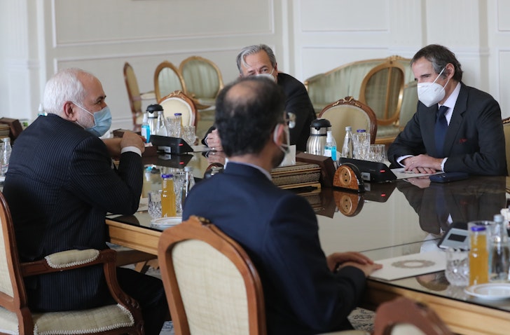 Iran' foreign minister (L) meets with the director general of the IAEA (R) in Tehran on Feb. 21, 2021. (Photo via Getty Images)