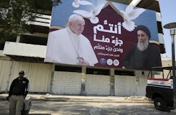 Giant billboard bears portrait of Pope Francis and Grand Ayatollah Ali Sistani in Baghdad on March 3, 2021 (via Getty Images)