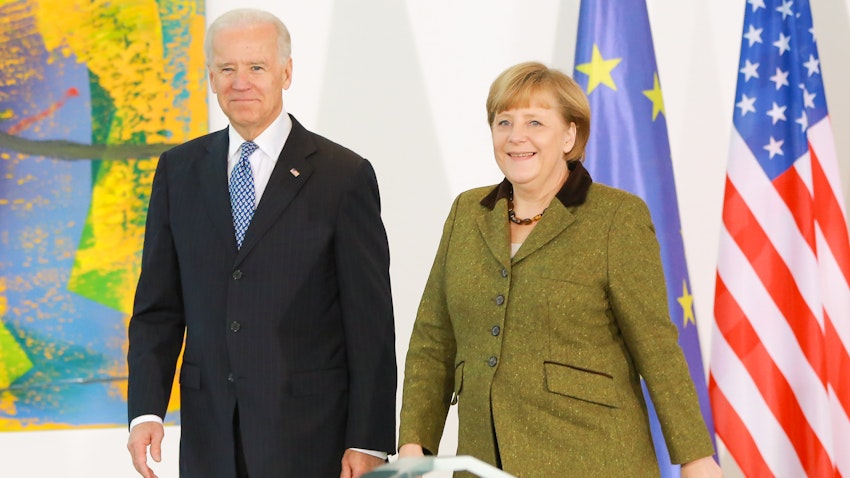 Then US Vice President Joe Biden and German Chancellor Angela Merkel speak to the media prior to talks at the Chancellery on Feb. 1, 2013 in Berlin, Germany. (Photo via Getty Images)