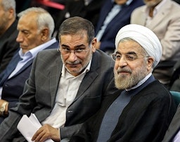 Hassan Rouhani and Ali Shamkhani at a summit for Iranian veterans of the 1980-88 Iran-Iraq war. Tehran, Iran. July 16, 2013. (Photo by Hamed Malekpour via Tasnim News Agency)
