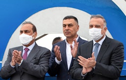 Prime Minister Mustafa Al-Kadhimi along with Iraqi officials during a Grand Faw port ceremony on Apr. 11, 2021 . (Photo via Getty Images)