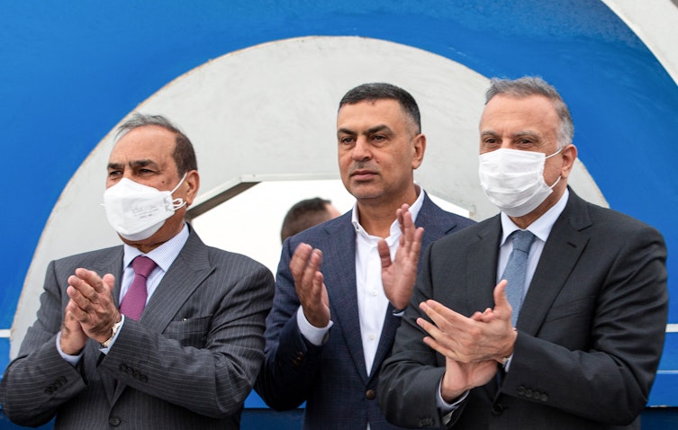 Prime Minister Mustafa Al-Kadhimi along with Iraqi officials during a Grand Faw port ceremony on Apr. 11, 2021 . (Photo via Getty Images)