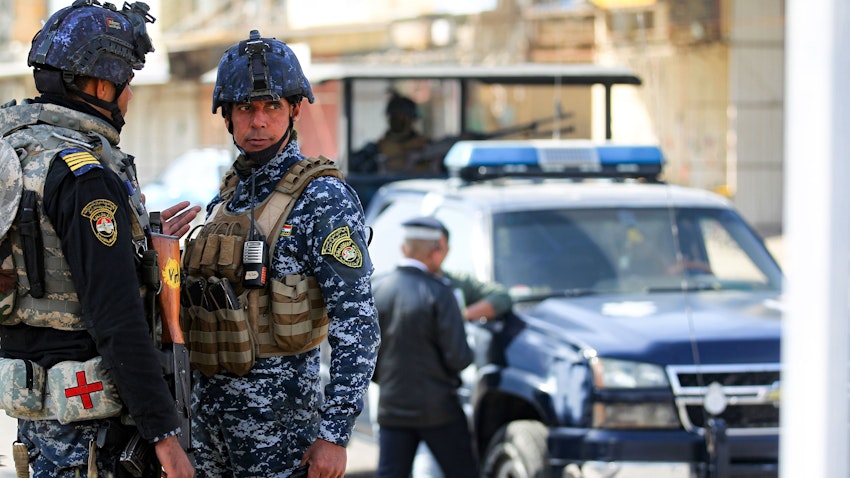 Iraqi security forces stand guard at a checkpoint. Baghdad, Iraq. Jan. 29, 2021. (Photo via Getty Images)