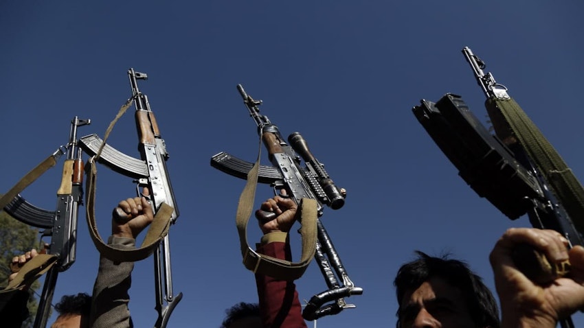 Supporters of the Houthis hold up firearms in Sana'a, Yemen on Jan. 18, 2021. (Photo via Getty Images)