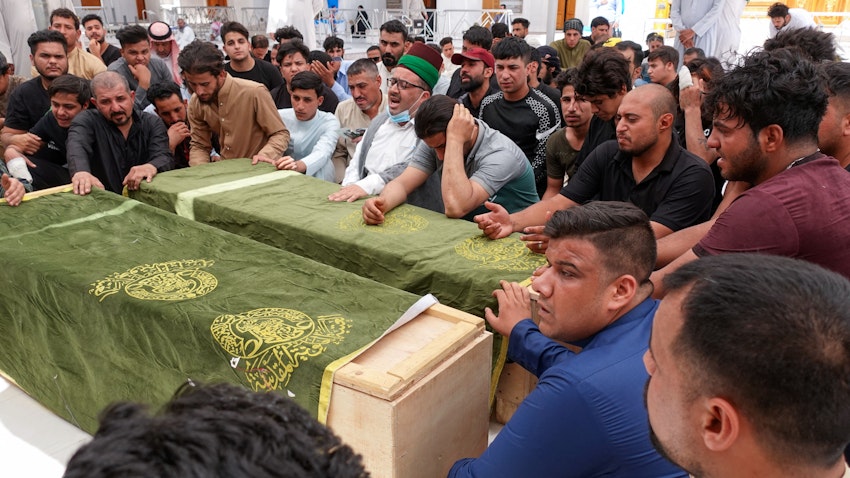 Iraqis mourn loved ones killed in a fire at Baghdad’s Ibn Al-Khatib hospital. Najaf, Iraq. April 25, 2021. (Photo via Getty Images)
