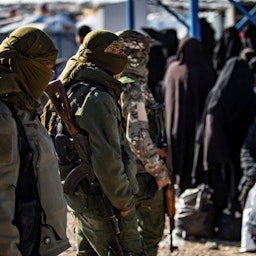  Kurdish fighters guard Al-Hol camp which holds relatives of Islamic State militants in Hasakeh governorate, Syria on Feb. 20, 2021. (Photo via Getty Images)