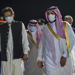 Pakistan's Prime Minister Imran Khan (L) is welcomed by Saudi Crown Prince Mohammed bin Salman in Saudi Arabia on May 8, 2021. (Photo via Getty Images) 