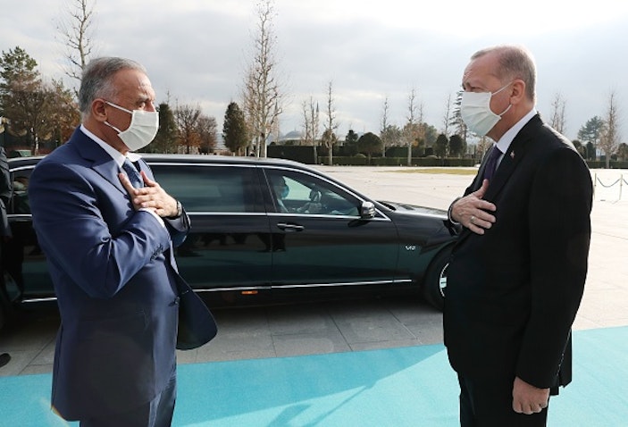 Turkish President Recep Tayyip Erdogan (R) welcomes Iraqi Prime Minister Mustafa Al-Kadhimi at the Presidential Complex in Ankara, Turkey on Dec. 17, 2020. (Photo via Getty Images) 