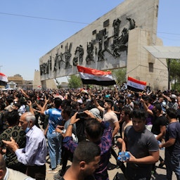 Demonstrators gather at Tahrir Square to protest against a wave of killings of activists and journalists in Baghdad, Iraq on May 25, 2021.  (Photo via Getty images)