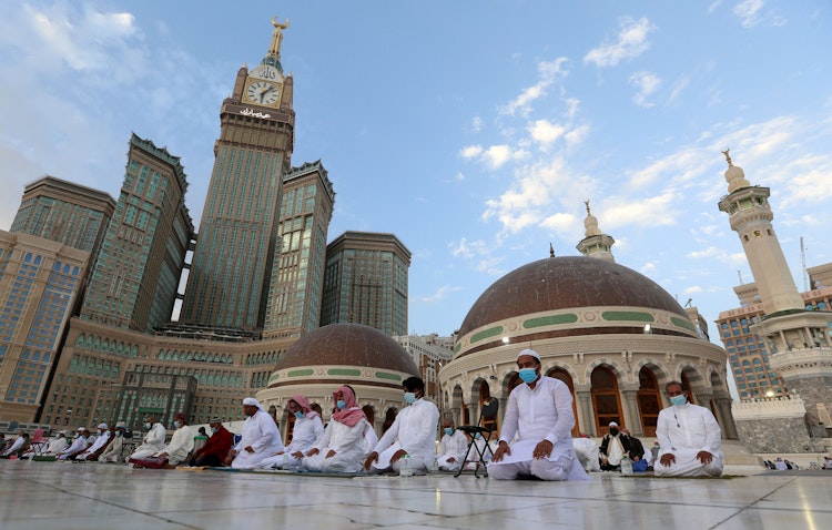 Worshippers perform their morning prayers at the Grand Mosque in Mecca, Saudi Arabia. May 13, 2021. (Photo via Getty Images)