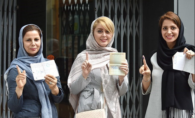 Iranian women pose for a photo after casting their votes in presidential elections in Rasht, Iran on May 20, 2017. (Photo by Mohammad Ranjbar via Tasnim News Agency)