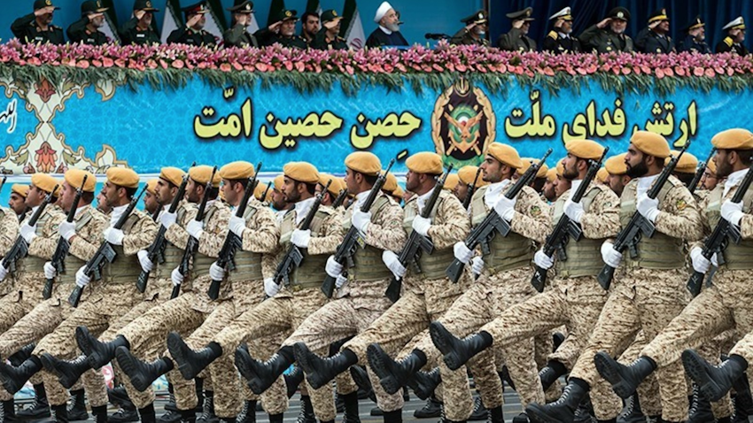 Iranian President Hassan Rouhani (top center) reviews army troops marching during the National Army Day parade in Tehran, Iran on Apr. 18, 2019. (Photo by Hossein Zohrevand via Tasnim News Agency)