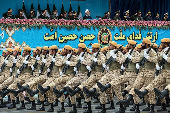 Iranian President Hassan Rouhani (top center) reviews army troops marching during the National Army Day parade in Tehran, Iran on Apr. 18, 2019. (Photo by Hossein Zohrevand via Tasnim News Agency)