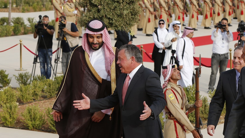 Jordan's King Abdullah II speaks with Saudi Arabia's then deputy Crown Prince Mohammed bin Salman in Amman on Aug. 4, 2015. (Photo via Getty Images)