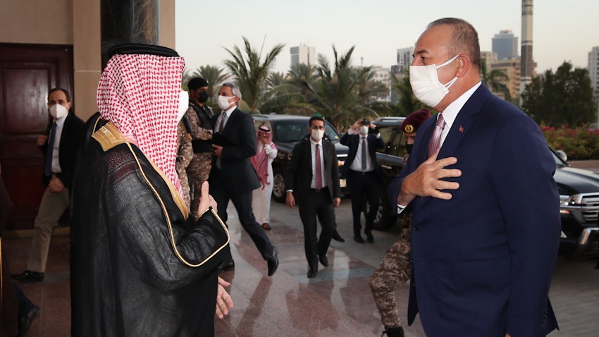Saudi Foreign Minister Faisal bin Farhan Al Saud (L) welcomes his Turkish counterpart Mevlüt Çavuşoğlu in Saudi Arabia on May 11, 2021. (Photo via Getty Images)