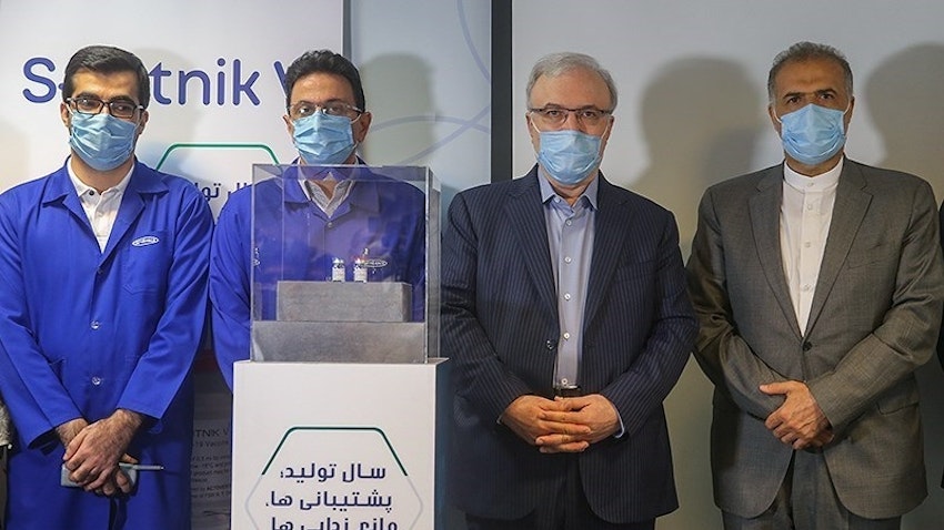 Health Minister Saeed Namaki and Tehran's ambassador to Moscow at the ceremony of unveiling the production of Sputnik V in Iran. June 26, 2021 (Photo by Abbas Shariati via Tasnim News Agency)