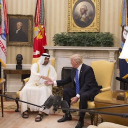 Then US President Donald Trump welcomes Abu Dhabi Crown Prince Mohammed bin Zayed Al Nahyan in the Oval Office on May 15, 2017. (Photo via Getty Images)