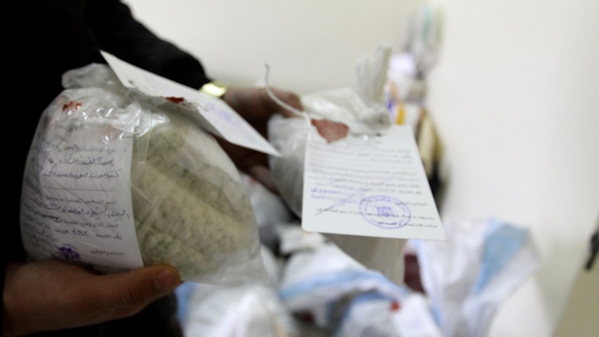 Police show seized drugs and Captagon pills in Damascus on Jan. 4, 2016. (Photo via Getty Images)