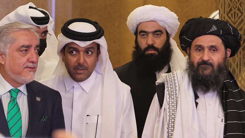 Head of Afghanistan's High Council for National Reconciliation Abdullah Abdullah (L) and Taliban political office head Mullah Abdul Ghani Baradar in Doha, Qatar on July 18, 2021. (Photo via Getty Images)