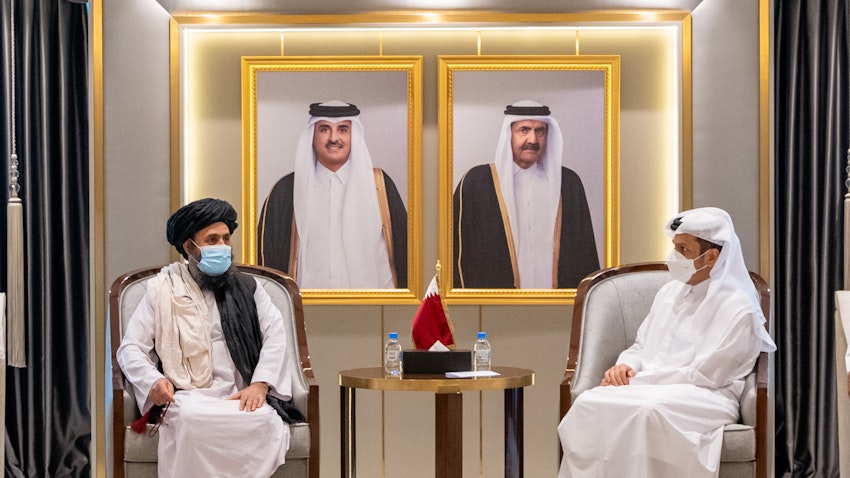 Qatari Deputy Premier and Foreign Minister Sheikh Mohammed bin Abdulrahman Al Thani (R) meets with the head of the Taliban's political in Qatar Abdul Ghani Baradar (L) in Doha on Aug. 17, 2021. (Photo via Getty Images)