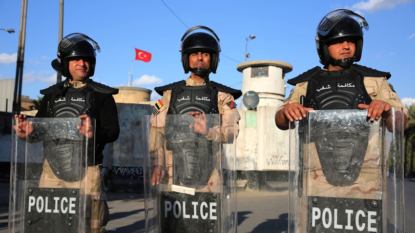 Iraqi riot police protect the Turkish embassy in Baghdad, after calls on social media to protest Turkey’s vows to invade Sinjar, on Feb.18, 2021. (Photo via Getty Images)