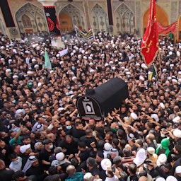 Mourners carry the coffin of Grand Ayatollah Muhammad Saeed Al-Hakim at his funeral in Najaf, Iraq on Sept. 5, 2021. (Photo via Getty Images)