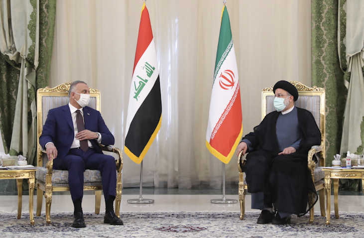 Iraq’s Prime Minister Mustafa Al-Kadhimi (L) meets Iran’s president Ibrahim Raisi (R) in Tehran on 12 Sep. 2021 (Photo via Iranian presidency)