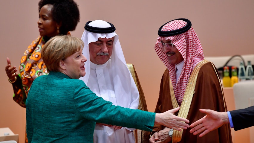 German Chancellor Angela Merkel chats with members of the Saudi delegation at the G20 economic summit in Hamburg, Germany on July 8, 2017. (Photo via Getty Images)