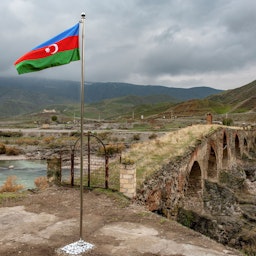 An Azerbaijani national flag flies in Jebrayil district at the country's border with Iran on Dec. 9, 2020. (Photo via Getty Images)
