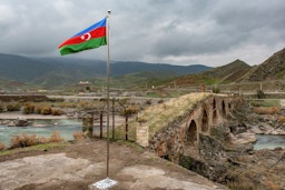 An Azerbaijani national flag flies in Jebrayil district at the country's border with Iran on Dec. 9, 2020. (Photo via Getty Images)