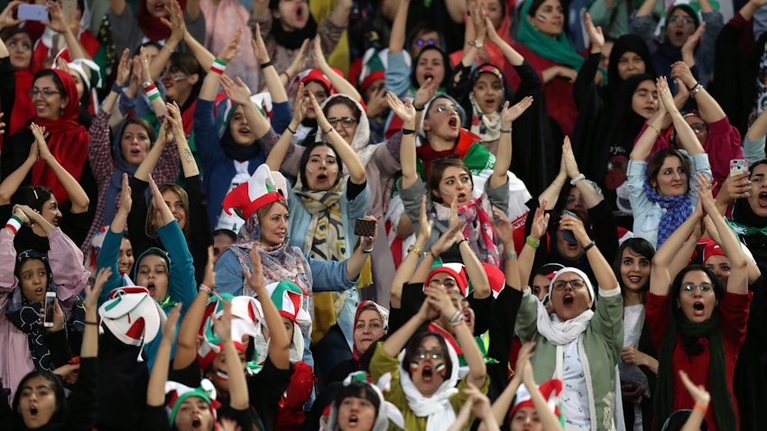 Female football fans show their support during the Iran vs. Cambodia match at Azadi Stadium in Tehran, Iran on Oct. 10, 2019. (Photo via Getty Images)