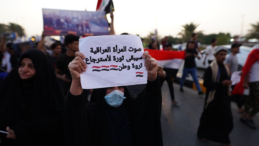 Hundreds of Iraqis protest demanding justice for demonstrators killed during the 2019 revolt at the Tahrir Square in Najaf, Iraq on Oct. 1, 2021. (Photo via Getty Images)