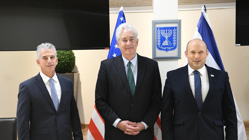 CIA director William Burns (C) meets Israel’s Prime Minister Naftali Bennett (R) and Mossad chief David Barnea (L) in Tel Aviv on Aug. 11, 2021. (Photo by Amos Ben Gershom/GPO handout via Getty Images)