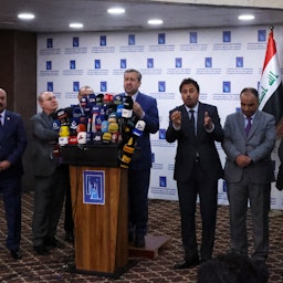 Judge Jalil Adnan Khalaf (C), chairman of Iraq's Independent High Electoral Commission (IHEC), holds a conference about the Oct. 10 parliamentary elections in Baghdad on Oct. 12, 2021. (Photo via Getty Images)