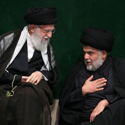Iran’s Supreme Leader of Iran Ayatollah Ali Khamenei (L) and Sadrist leader Muqtada Al-Sadr (R) attend a mourning ceremony on Ashura in Tehran, Iran on Sept. 11, 2019. (Photo via Getty Images)