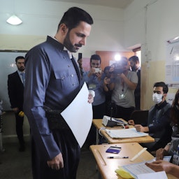 Shaswar Abdulwahid, the head of the New Generation Movement, registers to cast his vote for the Iraqi parliamentary elections in Sulaimaniyah, Iraq on Oct. 10, 2021. (Photo via Getty Images)
