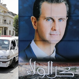 A large sign bearing the portrait of Syria's President Bashar Al-Assad is displayed in Damascus on May 10, 2021. (Photo via Getty Images)