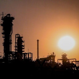 The sun sets in one of the refineries of the South Pars Gas Complex in Assaluyeh, Iran on Oct. 19, 2021. (Photo by Narges Mokhtar via Shana)