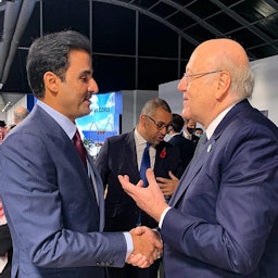 Qatari Emir Sheikh Tamim bin Hamad Al Thani (L) meets with Lebanese Prime Minister Najib Mikati during a UN climate summit in Glasgow on Oct. 31, 2021. (Handout photo via Twitter)