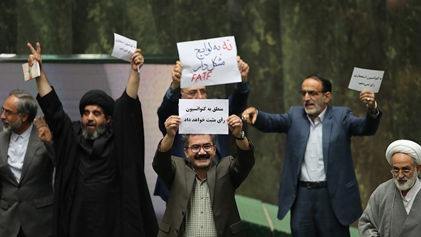 Iranian MPs express their agreement or opposition to the ratification of one of the conventions related to FATF in the parliament in Tehran on Oct. 7, 2018. (Photo via Tasnim News Agency)