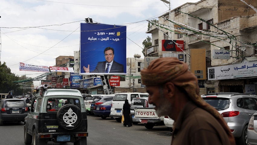 A portrait of the Lebanese Information Minister George Kordahi is seen on a billboard in Sana’a, Yemen on Oct. 31, 2021. (Photo via Getty Images)