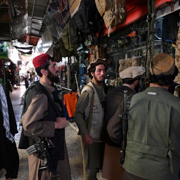 Taliban fighters shop at Bush market in Kabul on Sept. 9, 2021. (Photo via Getty Images)